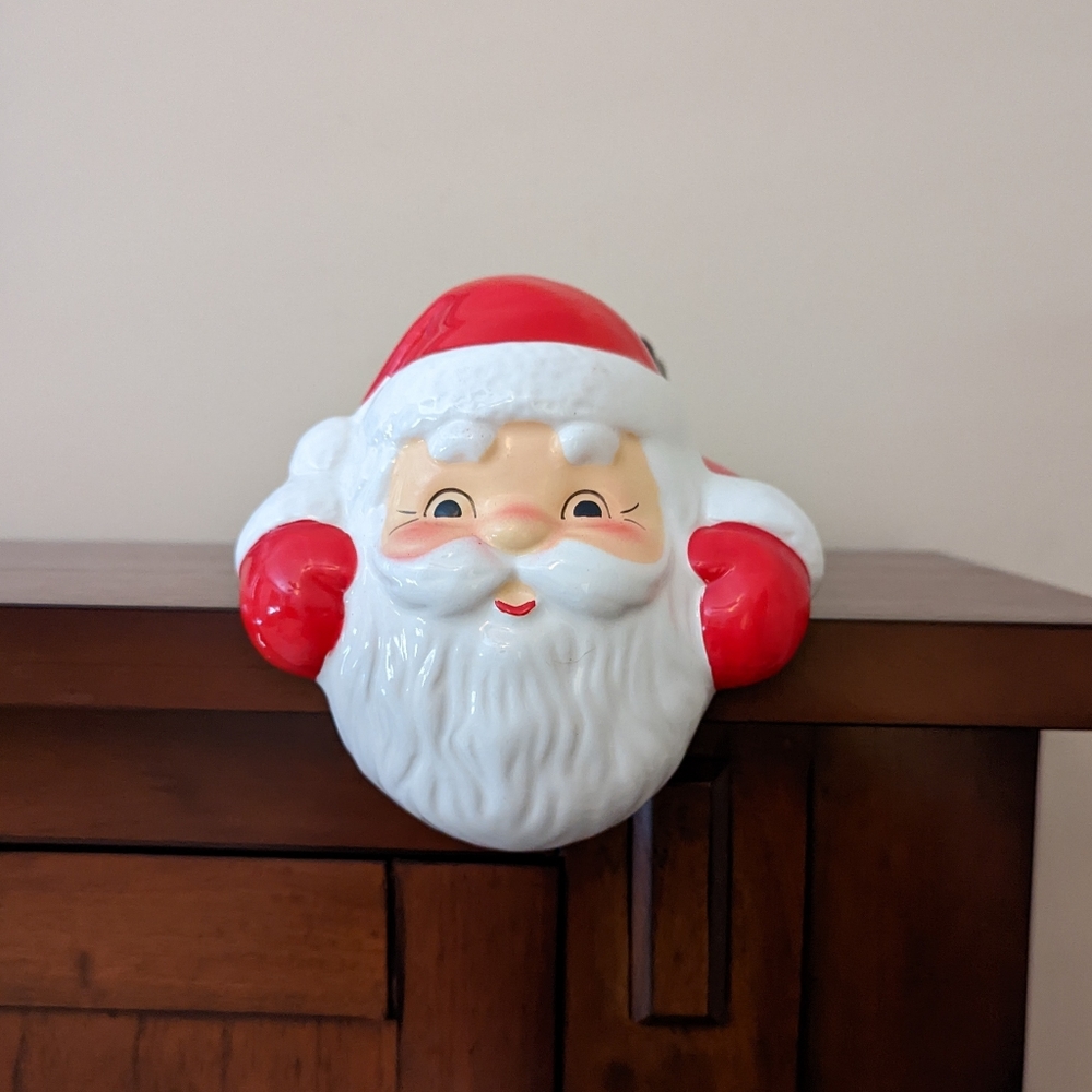 Wicks and Sticks Santa Claus ceramic over a shelf candle holder